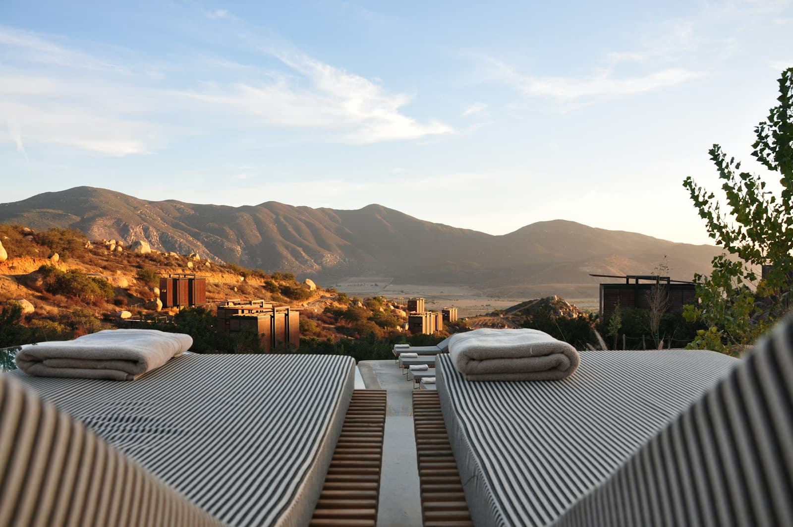 Terrace loungers overlooking the hills at sunset