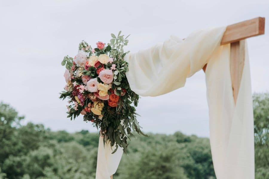Ceremony arch detail with pink and cream florals